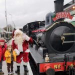Two children with Father Christmas