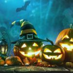 spooky Image of carved pumpkins, one in a witches hat